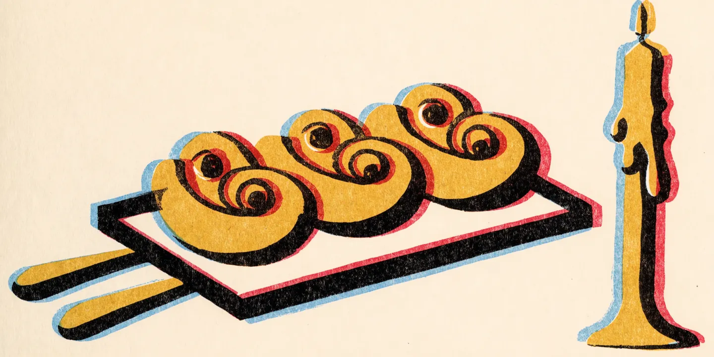 Illustration: saffransbullar formade som S med russin p\u00e5 bakpl\u00e5t.